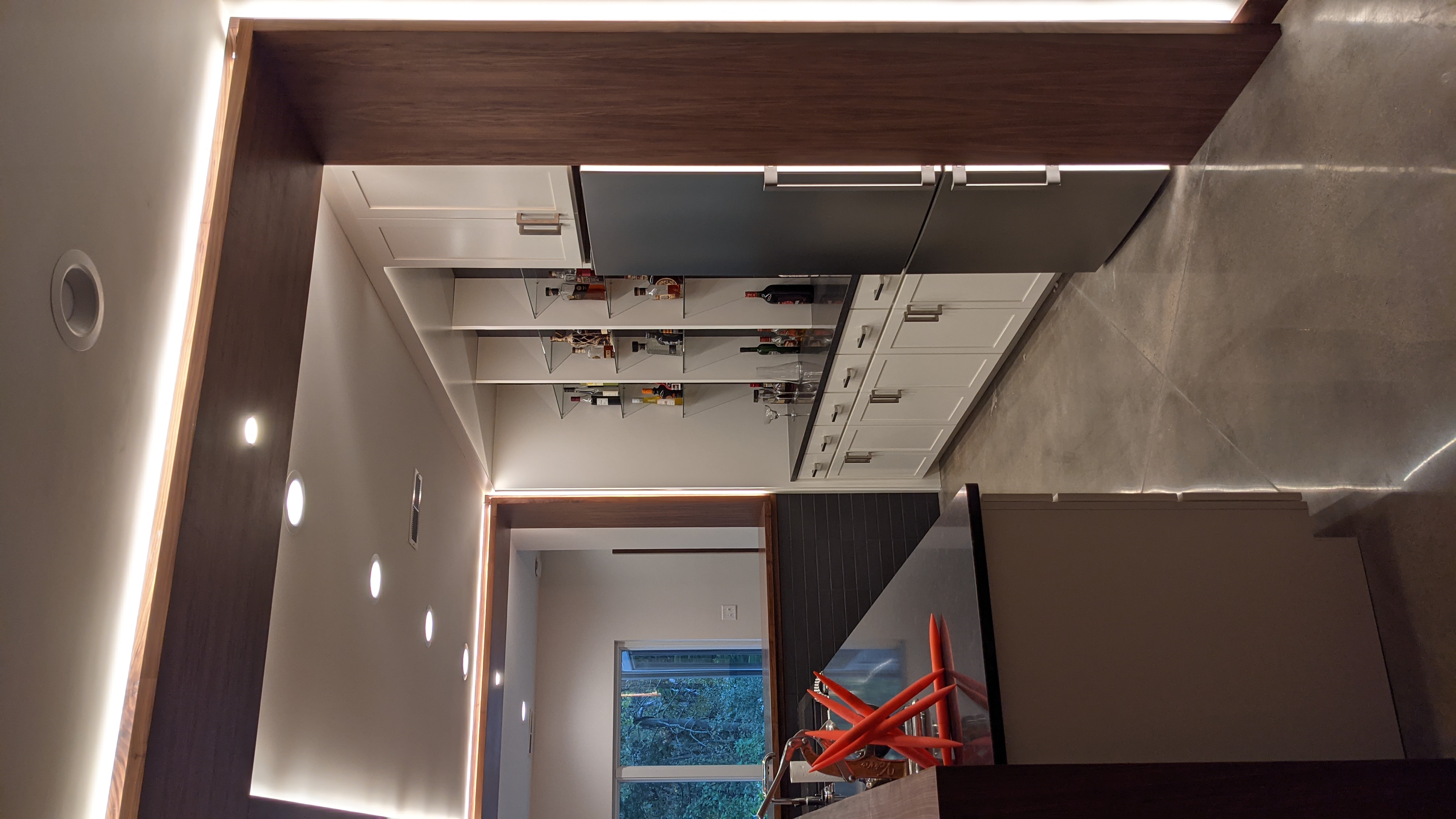 Custom Barback Istallation With Glass Shelves and custom built ins