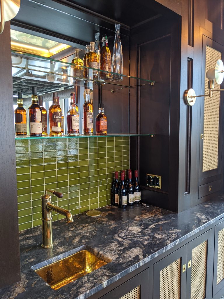 custom wetbar barback istallation with glass shelves in iowa